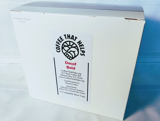 I brew cup box with the Coffee That Helps logo and the name "Decaf Bold" written on it.
